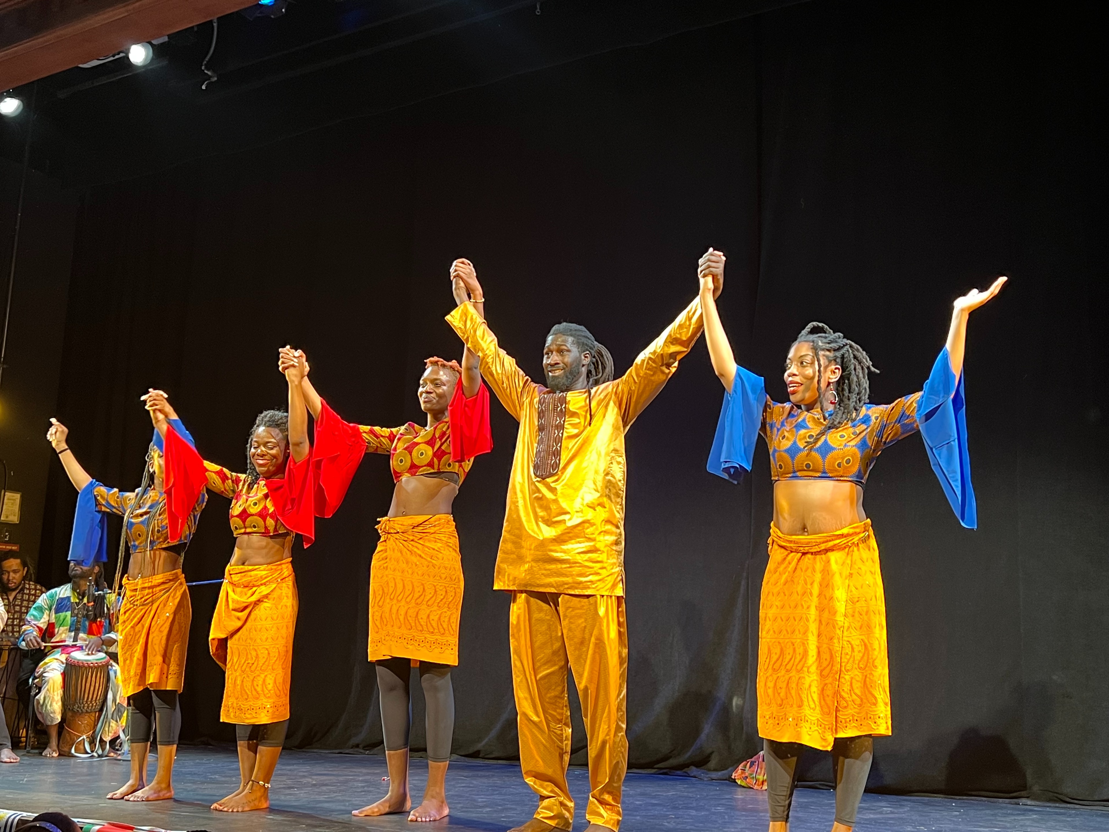 Kofago Dance Ensemble curtain call on stage
